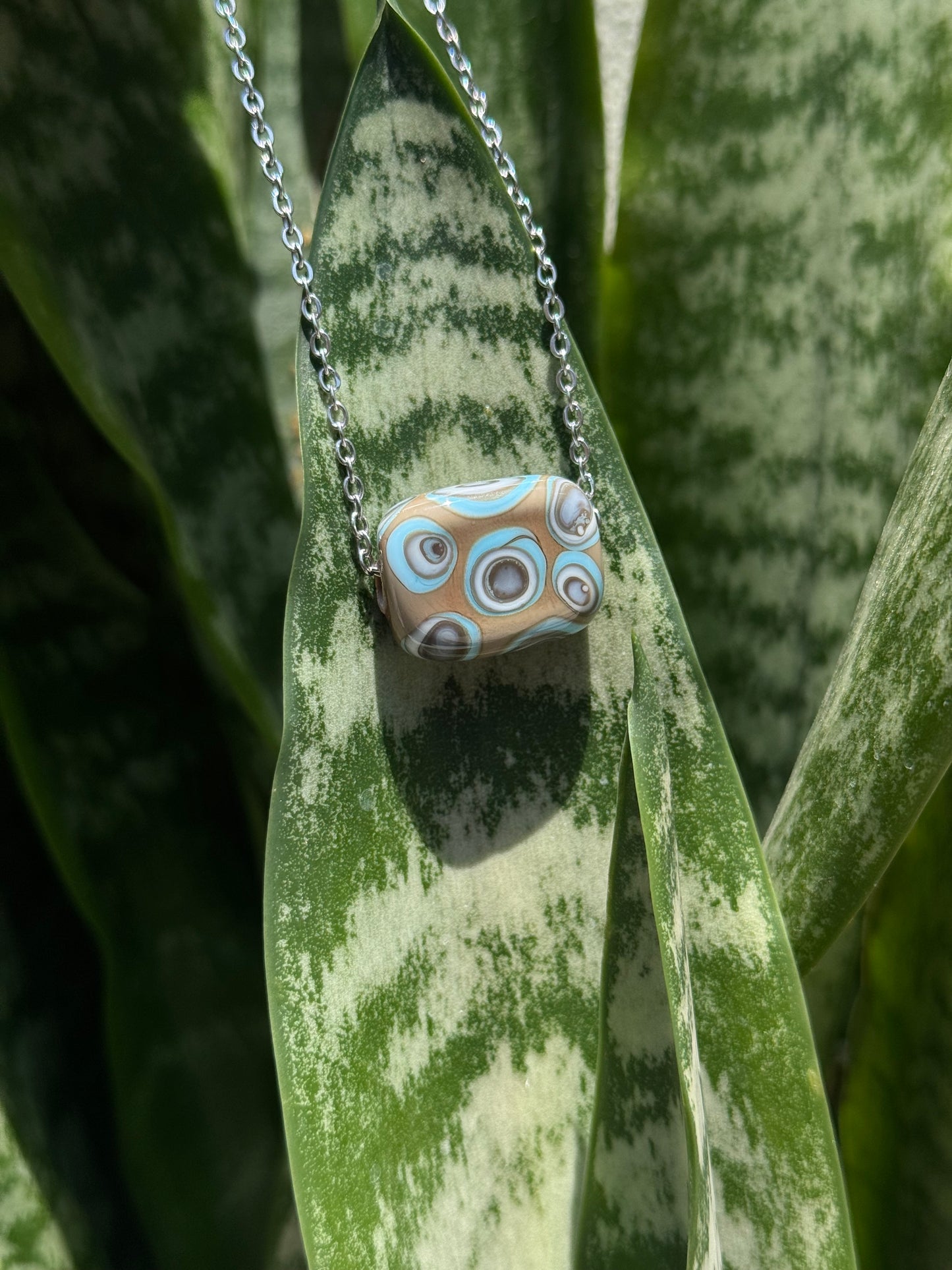 Pendant • blue brown ivory